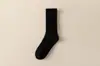 Calcetines de punto grueso de tubo alto para mujer, modernos, para primavera y otoño, calcetines largos blancos de tubo para mujer, calcetines Zhuji de color liso