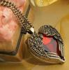 Cadena de Suéter de Corazón Europeo y Americano, Alas de Ángel Retro, Collar Largo de Gema de Corazón Rojo, Venta al por Mayor de Pequeños Regalos C099