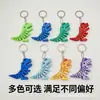 Dinossauro T-Rex articulado flexível impresso em 3D transfronteiriço mordendo dedo, pode ser usado como chaveiro, brinquedo antiestresse, item decorativo
