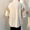 Nueva camisa de verano para hombre de cinco puntos con manga corta, bloques de color, lujo ligero, corte holgado, seda helada fresca y una bonita caída
