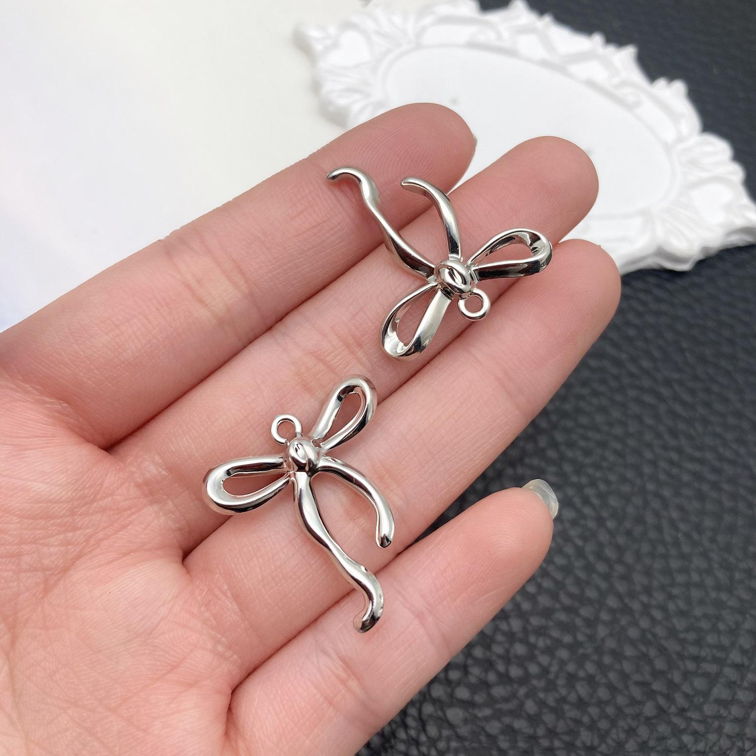 21403-DL-白k保色锌合金弯曲蝴蝶结25x23mm-1