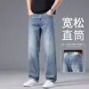Calças jeans azuis leves de alta qualidade italianas para o verão para homens, calças casuais de negócios de corte reto soltas, calças da moda