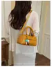 Bolso de mano de diseño de nicho nuevo para comercio transfronterizo, elegante bolso tipo bowling para el hombro y cruzado para el día a día con patrón tejido para mujer