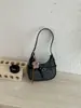 Bolso de moda de diseño nicho tipo dumpling, nuevo bolso de media luna retro transfronterizo elegante para llevar bajo el brazo, versátil bolso de hombro y cruzado, moderno