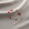 Pulsera de acero de titanio Jin Hui no se decolora cruzada popular femenina trébol de cinco hojas diamante estilo Ins personalidad chapado al vacío 18K