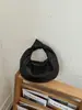 Sentido de diseño transfronterizo diseño de nicho bolso de mano para mujer nuevo estilo popular textura tejida retro bolso tipo tamal bolso de mano para exteriores