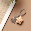 Cara de muñeca creativa y peculiar, famosa en internet, caricatura estilo sanador, lindo dije de borla para bolso, llavero y artículo decorativo hecho de boj con diseño de arcoíris