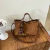 Bolso bandolera de un solo hombro texturizado, nuevo estilo para el trabajo, bolso tote de gamuza, versátil vintage 2026 para mujer, gran capacidad, al por mayor