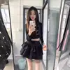 Falda Corta Estilo Tarta Negra Ajustada al Cuerpo para Mujeres Petites, Estilo Universitario, Verano 2025 Pura Deseo Chica Picante Falda de Línea A de Cintura Alta