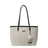Bolsa Feminina Texturizada de Cor Sólida 2025 Nova Moda Grande Capacidade Pingente para o Dia a Dia Casual de Ombro Único Bolsa Tote