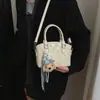 Bolso de Mano con Relieve de Moda para Mujer 2026 Nuevo Bolso Cubo Elegante de Tendencia Bolso de Hombro Cruzado Versátil con Textura