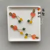 Precio mayorista directo de fábrica pulsera hecha a mano pulsera con colgante diy accesorios pequeños deslizantes colgante de garra de gato lindo Joker