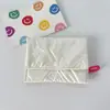 Bolsa de Monedas Plegable con Lazo de Corazón de PU Brillante Portátil Tarjetero Rellena de Algodón Acolchada Bolsa de Mano para Toallas Sanitarias