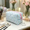 Bolsa de almacenamiento octagonal en stock transfronteriza, alto valor estético, bolsa de maquillaje de gran capacidad, bolsa cuadrada pequeña a rayas de bloqueo de color para dormitorio al por mayor