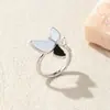 Versión Coreana Anillo de Concha Blanca Lazo Cruzado Esmalte Goteo Nácar Diamante Triturado Temperamento Elegante Anillo Abierto Ajustable