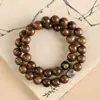 Item Popular Transmitido ao Vivo: Pulseira de Círculo Duplo Feita de Madeira Nanmu Dourada de Seda Natural Envelhecida, Apresentando os Oito Deuses Guardiões e os Doze Signos do Zodíaco, Adequada para Manusear e Colecionar