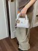 Bolso de mano de cadena con patrón de rombos estilo coreano para mujer, nuevo bolso de hombro retro de moda 2026, bolso cruzado versátil y moderno