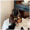 Bolso de mano retro de gamuza de nicho para mujer, nuevo bolso cruzado versátil de moda 2026 con correa de cadena, bolso de hombro con forma de albóndiga