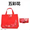 Fábrica para bolsa de mano impermeable de tela Oxford para regalos, bolsa de compras plegable de moda colorida con flores, bolsa de almacenamiento de protección ambiental portátil