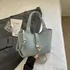 Elegante y moderno bolso tipo cubo para mujer, nuevo bolso de un solo hombro, 2026 verano, color sólido, piel suave, bolso cruzado súper popular