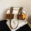 Moda transfronteriza diseño de doble bolsillo bolsa de boliche para mujer nuevo tacto de alta gama bolsa de almohada de una sola pieza bolsa de axila retro moderna