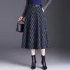 Saia xadrez jacquard para mulheres, novo estilo outono 2026, saia de cintura alta afunilada em A, saia de comprimento médio fashion e moderna