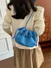 Bolso tipo cubo con flecos estilo coreano para mujer, nueva colección otoño/invierno 2026, acabado mate, bolso de hombro, bolso cruzado, diseño de alta gama, bolso de cordón de nicho