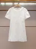 Vestido Blanco de Verano Nuevo de Alta Gama para Mujer de Shenzhen, Estilo Francés, Diseño de Moda, Bordado, Hueco, Manga Corta