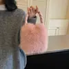 Coleção nova de outono e inverno transfronteiriça: bolsa de mão lisa, elegante e fofa para mulheres, exalando uma sensação luxuosa e macia