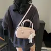 Bolsa Pequena Quadrada Casual Moderna para Carregar na Mão para Mulheres 2025 Primavera Nova Bolsa de Ombro Simples Bolsa Transversal Casual Estilo Ocidental Personalizada