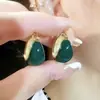 Pendientes de ojo de gato con diamantes geométricos y diseño de nicho de temperamento, populares en Internet, pendientes delgados que combinan con todo.
