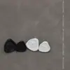Botón de presión de broche de metal con forma de triángulo irregular botón metálico top para mujer chaqueta corta abrigo cierre de presión blanco y negro