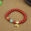 Pulsera de cinabrio rojo al por mayor con alto contenido de arena de oro púrpura de 8 m de cuentas redondas con colgante pulsera de la paz golondrina bestia valiente viva