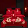 Juego de ropa de cama de lujo estilo chino, hecho de algodón 100% de fibra larga, un juego de cuatro piezas que incluye una sábana y una funda de edredón de algodón puro rojo, perfecto para la alcoba de una recién casada.