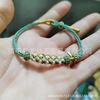 Pulsera Tejida a Mano de Flor de Durazno de Ocho Hilos con Nudo de Flor de Durazno Se Puede Usar con Oro Jade Ámbar Cera de Abeja Venta Directa de Fábrica Mayorista