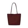 Bolso de mano con textura de tejido cruzado para mujer 2026 nuevo estilo de verano de alta calidad versátil para el trabajo diario bolso tipo cubo de un solo hombro madre-hijo