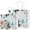 Bolsa no tejida en stock Impresión a color de película Bolso de mano para llevar ropa a domicilio Regalo publicitario Bolsa de compras promocional al por mayor