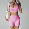 Nuevo conjunto de yoga transfronterizo: Shorts de fitness tipo durazno sin costuras que levantan los glúteos con almohadillas en el pecho, top deportivo y sujetador de yoga