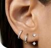Conjunto de tres pendientes de lujo con diseño de mariposa y estrella de circonitas, chapados en latón dorado auténtico, estilo europeo y americano.