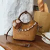 Bolso Cubo de Gamuza Nuevo 2025 Bolso de Mano Cruzado para Mujer Tendencia de Moda Retro Nicho Casual para el Trabajo Bolso de Mujer