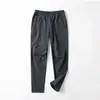 Estilo Outono e Inverno ao Ar Livre Luxo Leve Estilo Casal Masculino Slim Fit Vento e Chuva à Prova de Vento Impermeável Softshell Calças Casuais Esportivas Calças Casuais