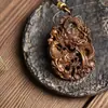 Ventas directas de fábrica de marca Dragón de madera de agarwood pieza hueca acompañante adornos para coche joyería para hombres y mujeres artesanías de tallado