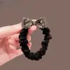 Acessório de cabeça de temperamento da moda coreana, laço de cristal, elástico de cabelo de salsicha pequena, elástico de cabelo para rabo de cavalo baixo, corda de cabeça de couro, atacado