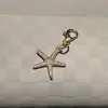 Estilo marino transfronterizo nuevo artículo charm de zapato de estrella de mar concha colgante azul marino hebilla de cordón de zapato compatible con papá de entrenamiento alemán zapatos de ballet