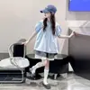 Tops de Manga Corta para Niñas Verano 2026 Nuevo Estilo Camisa de Muñeca de Verano para Niña Grande Moda de Verano para Niñas de Secundaria Blusa de Verano