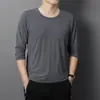 Camiseta de manga larga de color liso versátil, holgada, estilo americano, cuello redondo, de seda de leche de alta calidad, para hombre y mujer, para primavera y otoño