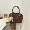 Bolso Cruzado Pequeño de Alta Gama de Nicho Otoño e Invierno Transfronterizo para Mujer 2026 Nuevo Bolso de Mano de Gamuza Bolso Cubo