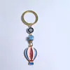 Colgante de Serie Ojo de Diablo Transfronterizo Europeo y Americano Colgante de Llavero de Joyería de Animales Ojo de Hueso con Goteo de Aceite Accesorios de Aleación para Mujeres