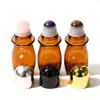 Botella dispensadora de aceite de ricino de vidrio marrón de 30 ml y 50 ml Botella con rodillo de jade de cristal natural Botella con rodillo de cuarzo rosa