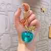 Accesorios pequeños de bricolaje transfronterizos, colgante de llavero de manzana galvanizado, colgante exquisito para mujer, llavero colgante pequeño al por mayor